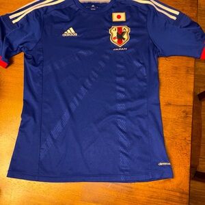FA Blue Soccer Jersey with Red and White Accents